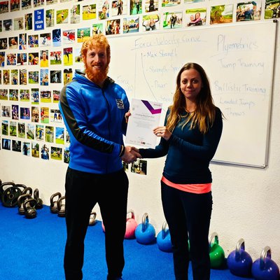 Photo of Chrissie receiving Active IQ Level 2 Certificate in Gym Instructing from Jason Curtis